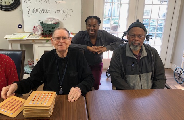 Senior and caregiver spending time together at home